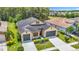 Charming single-Gathering home featuring a manicured front yard and a two-car garage at 1958 Marshberry Ct, Trinity, FL 34655