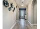 View of the foyer featuring tile flooring, arched doorways, and decorative wall art at 1958 Marshberry Ct, Trinity, FL 34655
