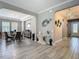 View of the foyer featuring a dining area, arched doorways, and decorative wall art at 1958 Marshberry Ct, Trinity, FL 34655