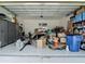 Spacious two car garage with storage cabinets and painted floor at 1958 Marshberry Ct, Trinity, FL 34655