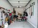 Organized garage space with tools, storage, and ample room for parking at 1958 Marshberry Ct, Trinity, FL 34655