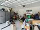 Garage with epoxy flooring, cabinet storage, and organization system at 1958 Marshberry Ct, Trinity, FL 34655