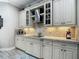 Bright kitchen with stainless steel appliances, granite countertops, tiled backsplash and modern cabinetry at 1958 Marshberry Ct, Trinity, FL 34655