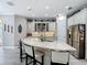 Spacious kitchen featuring a large center island, white cabinetry, and modern appliances at 1958 Marshberry Ct, Trinity, FL 34655