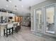 Bright kitchen with island, stainless steel appliances and access to adjacent living spaces and exterior at 1958 Marshberry Ct, Trinity, FL 34655