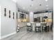 Spacious kitchen with white cabinetry, stainless appliances and granite countertops offers seating and modern finishes at 1958 Marshberry Ct, Trinity, FL 34655
