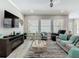 Spacious living room with a large TV, stylish seating, and plenty of natural light at 1958 Marshberry Ct, Trinity, FL 34655