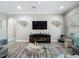 Bright living room with modern furniture, a large TV, and decorative accents at 1958 Marshberry Ct, Trinity, FL 34655
