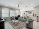 Open-concept living room leading to a modern kitchen, perfect for entertaining at 1958 Marshberry Ct, Trinity, FL 34655