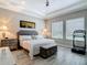 Elegant main bedroom with comfortable bed, stylish furnishings, and natural light at 1958 Marshberry Ct, Trinity, FL 34655