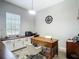 View of the home office featuring built-in cabinets and a wooden desk with stylish decor at 1958 Marshberry Ct, Trinity, FL 34655