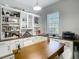 View of the home office with custom built-in shelving and a printer station at 1958 Marshberry Ct, Trinity, FL 34655