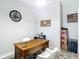 View of the home office featuring tile flooring and a wooden desk with stylish decor at 1958 Marshberry Ct, Trinity, FL 34655