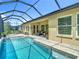 Beautiful backyard with an in-ground pool and patio area, perfect for entertaining at 1958 Marshberry Ct, Trinity, FL 34655