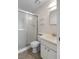 Well-maintained bathroom featuring a glass-enclosed shower and clean white fixtures at 2006 Hadrian Ct, Sun City Center, FL 33573