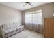 Serene bedroom featuring a large window and neutral tones at 2006 Hadrian Ct, Sun City Center, FL 33573