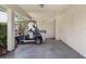 Carport featuring a golf cart and secure parking at 2006 Hadrian Ct, Sun City Center, FL 33573