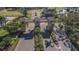 View of a community entrance featuring a gatehouse, palm trees, and landscaped grounds at 2006 Hadrian Ct, Sun City Center, FL 33573
