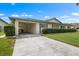 Charming single-story home featuring a private front drive and manicured landscaping at 2006 Hadrian Ct, Sun City Center, FL 33573