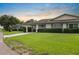 Charming single-story home featuring a private front drive and manicured landscaping at 2006 Hadrian Ct, Sun City Center, FL 33573