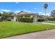 Charming single-story home featuring a private front drive and lush landscaping at 2006 Hadrian Ct, Sun City Center, FL 33573