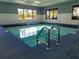 Well-maintained indoor pool with natural light, convenient steps, and tranquil ambiance at 2006 Hadrian Ct, Sun City Center, FL 33573