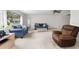 Spacious living room with neutral tones, comfortable seating, and ample natural light at 2006 Hadrian Ct, Sun City Center, FL 33573