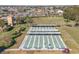 Well-maintained shuffleboard courts with covered seating, lush landscaping, and a peaceful setting at 2006 Hadrian Ct, Sun City Center, FL 33573