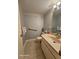 Bathroom features a vanity sink, toilet, towel bar and tiled flooring at 2221 Norwegian Dr # 15, Clearwater, FL 33763
