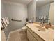 Bathroom featuring a vanity sink, toilet, grab bar and tile flooring at 2221 Norwegian Dr # 15, Clearwater, FL 33763