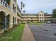 Lovely condo building featuring an inviting exterior and landscaped grounds at 2221 Norwegian Dr # 15, Clearwater, FL 33763
