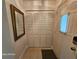 Hallway featuring a closet with white doors and a decorative mirror at 2221 Norwegian Dr # 15, Clearwater, FL 33763