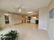 Spacious kitchen and adjacent dining area featuring neutral cabinets and tile flooring at 2221 Norwegian Dr # 15, Clearwater, FL 33763