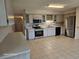 Bright kitchen featuring tile flooring, light cabinetry, and stainless steel appliances at 2221 Norwegian Dr # 15, Clearwater, FL 33763