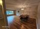 Charming living room with hardwood floors and dining area at 2221 Norwegian Dr # 15, Clearwater, FL 33763