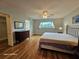 The main bedroom is spacious with attractive bamboo flooring, and has an ensuite bath and walk-in closet at 2221 Norwegian Dr # 15, Clearwater, FL 33763