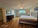 The main bedroom is spacious with attractive bamboo flooring, and has an ensuite bath and walk-in closet at 2221 Norwegian Dr # 15, Clearwater, FL 33763