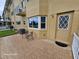 Patio with exterior door, corner window, and seating, next to building at 2221 Norwegian Dr # 15, Clearwater, FL 33763