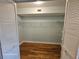 The walk-in closet boasts shelves for storage and the bamboo flooring is carried into this space at 2221 Norwegian Dr # 15, Clearwater, FL 33763