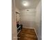 A walk-in closet with wire shelving, hard wood floor, and bifold doors at 2221 Norwegian Dr # 15, Clearwater, FL 33763