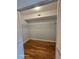 The walk-in closet boasts shelves for storage and the bamboo flooring is carried into this space at 2221 Norwegian Dr # 15, Clearwater, FL 33763