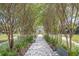 A tree-lined walking path with benches provides serene spots for relaxation in this well-maintained community at 2221 Norwegian Dr # 15, Clearwater, FL 33763