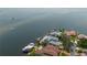 Aerial view of waterfront community showcasing luxurious homes with boat docks on a sunny day at 2279 Mermaid Ne Pt, St Petersburg, FL 33703