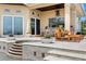 Outdoor patio featuring covered space, outdoor kitchen, grill, and luxurious outdoor furniture at 2279 Mermaid Ne Pt, St Petersburg, FL 33703