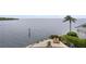 Beautiful backyard offers waterfront views and a private patio with lounge chairs at 2279 Mermaid Ne Pt, St Petersburg, FL 33703