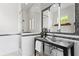 Sleek bathroom with modern fixtures, glass shower, and stylish mosaic tile accents at 2279 Mermaid Ne Pt, St Petersburg, FL 33703