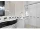Bright bathroom featuring a glass shower, stylish vanity, and decorative wall tiles at 2279 Mermaid Ne Pt, St Petersburg, FL 33703