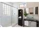 Bathroom featuring a glass-enclosed shower, modern vanity with a vessel sink, and neutral decor at 2279 Mermaid Ne Pt, St Petersburg, FL 33703
