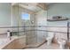 Walk-in shower with glass surround and multiple shower heads in luxurious bathroom at 2279 Mermaid Ne Pt, St Petersburg, FL 33703