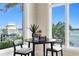 Cozy breakfast nook offers marina views, a small table, comfortable seating, and stylish decor at 2279 Mermaid Ne Pt, St Petersburg, FL 33703